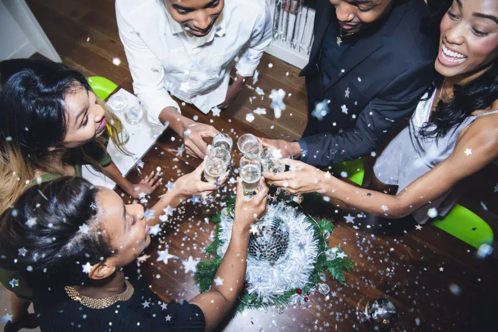 Partygoers clink champagne glasses to usher in the New Year.