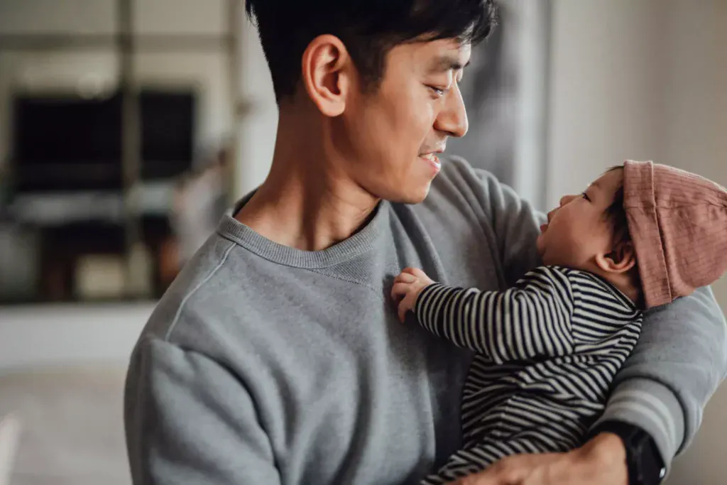 A father celebrates Father's Day with his baby.