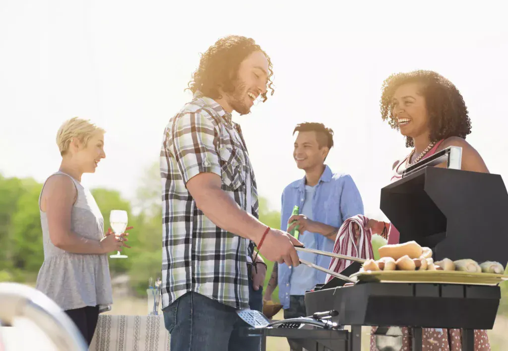 A Labor Day barbecue with hot dogs and beer.